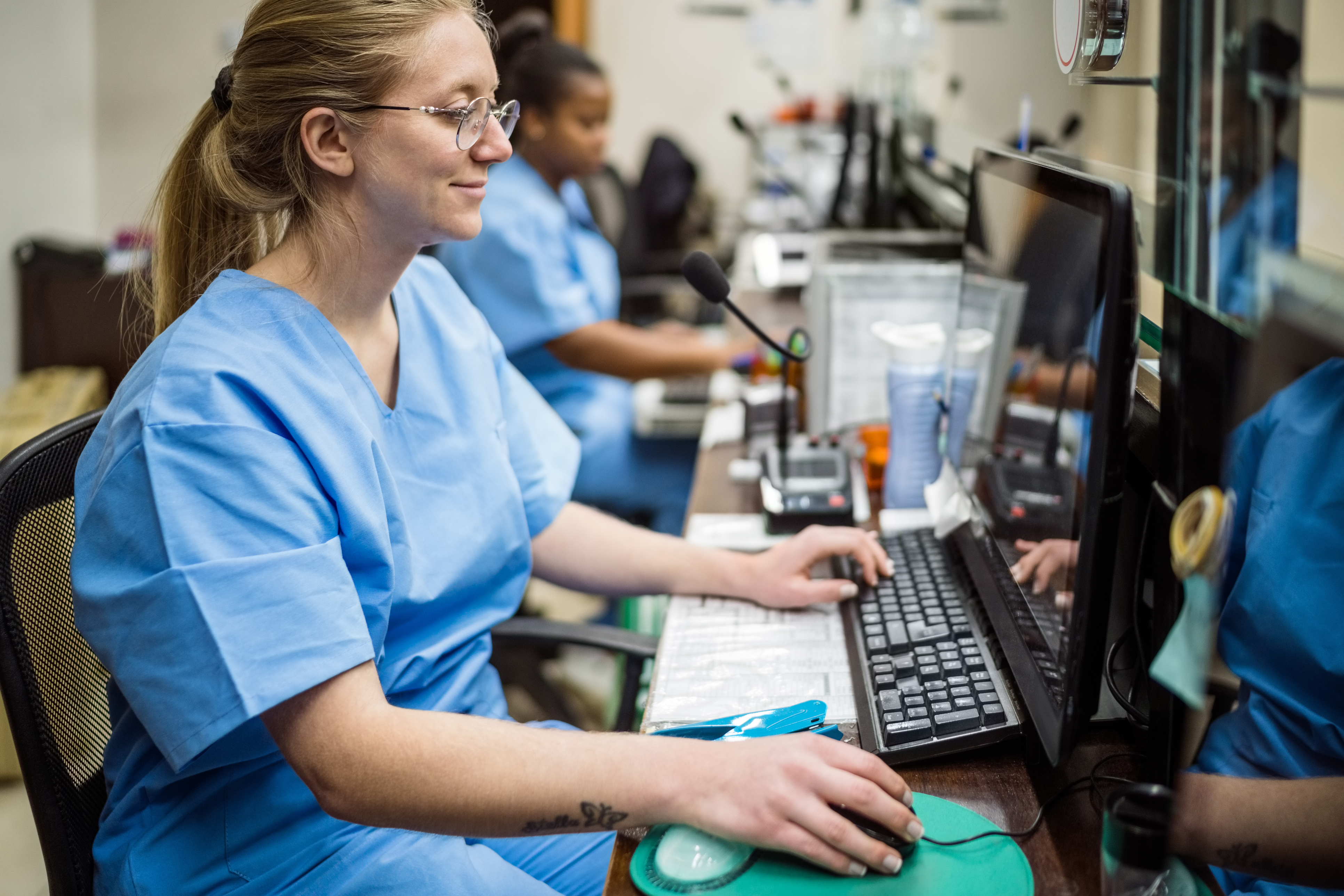 medical assistant at computer